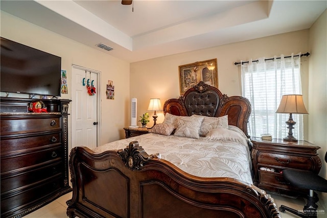 823 Sabrina Dr, Alamo, TX 78516 - bedroom featuring a tray ceiling, light tile patterned floors, and a ceiling fan