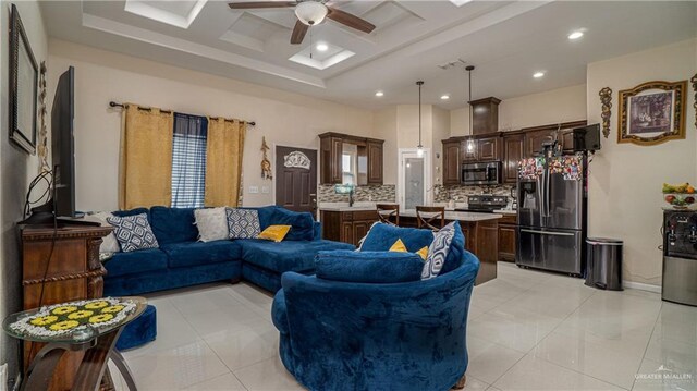 823 Sabrina Dr, Alamo, TX 78516 - living area featuring ceiling fan, a raised ceiling, recessed lighting, and light tile patterned floors