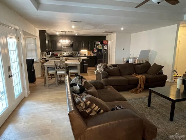 4308 Auburn Ave, Mcallen, TX 78504 - living room with healthy amount of natural light, a ceiling fan, and light wood-style flooring