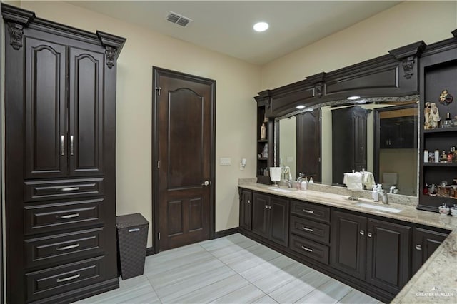 bathroom featuring tile patterned floors and vanity