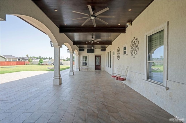 view of patio featuring ceiling fan