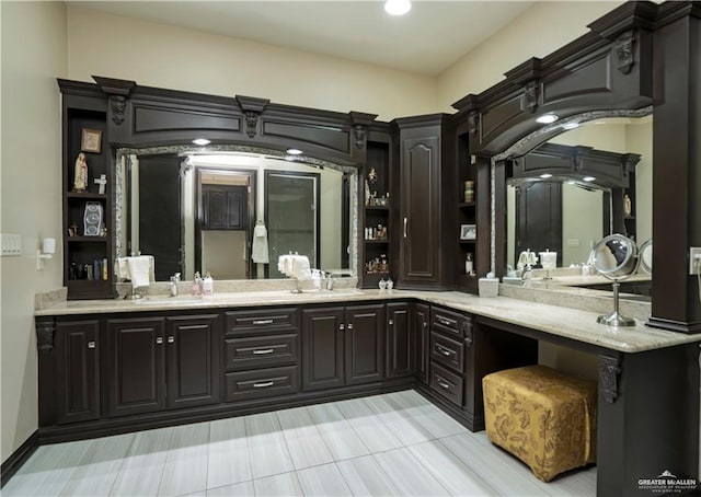 bathroom with tile patterned flooring and vanity