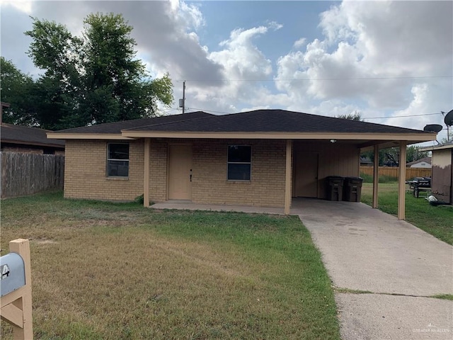 ranch-style house with a front yard and a carport