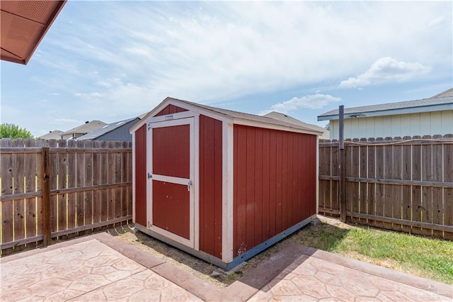 view of shed featuring a fenced backyard