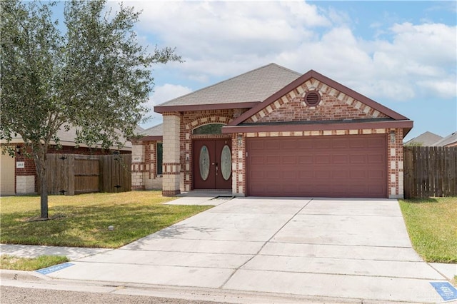 view of front of property featuring brick siding, concrete driveway, an attached garage, fence, and a front lawn