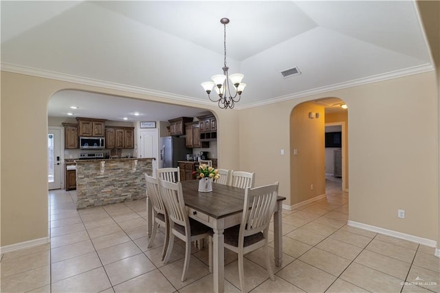 dining space with a chandelier, arched walkways, visible vents, and light tile patterned flooring