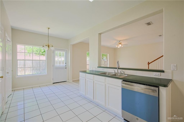 4612 Laurel Ave, Mcallen, TX 78501 - kitchen with dishwashing machine, a sink, dark countertops, a chandelier, and white cabinetry