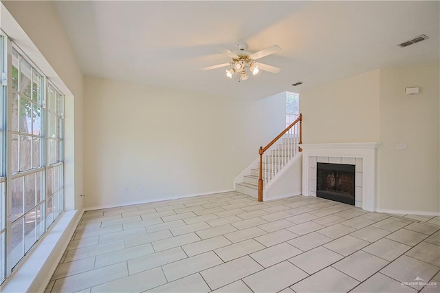 4612 Laurel Ave, Mcallen, TX 78501 - unfurnished living room with plenty of natural light, a ceiling fan, and stairs