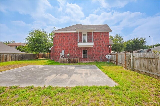 4612 Laurel Ave, Mcallen, TX 78501 - back of property featuring brick siding, a balcony, and a patio