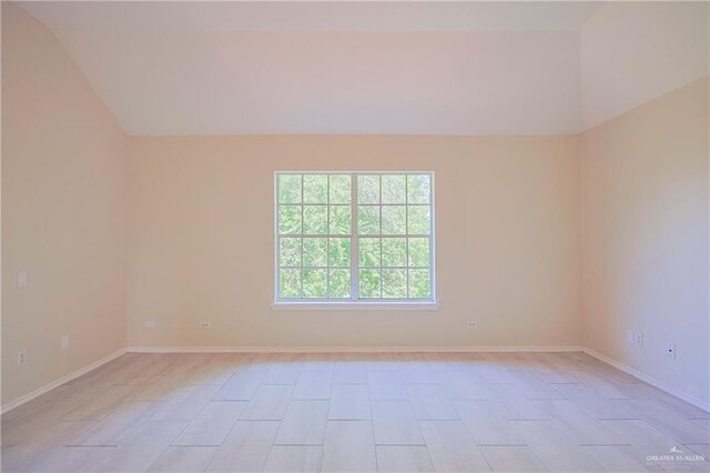 4612 Laurel Ave, Mcallen, TX 78501 - spare room featuring vaulted ceiling and baseboards