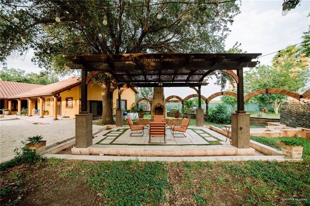 view of property's community featuring a patio and a pergola