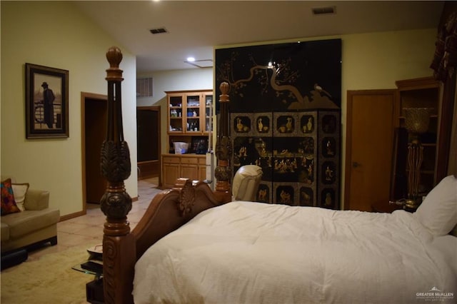 tiled bedroom featuring visible vents and baseboards