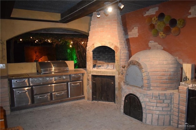 view of patio featuring exterior kitchen