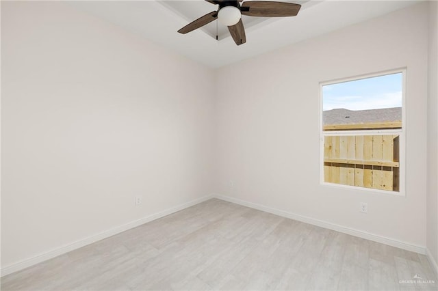 empty room with light hardwood / wood-style floors and ceiling fan