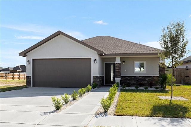 view of front of house with a front lawn and a garage