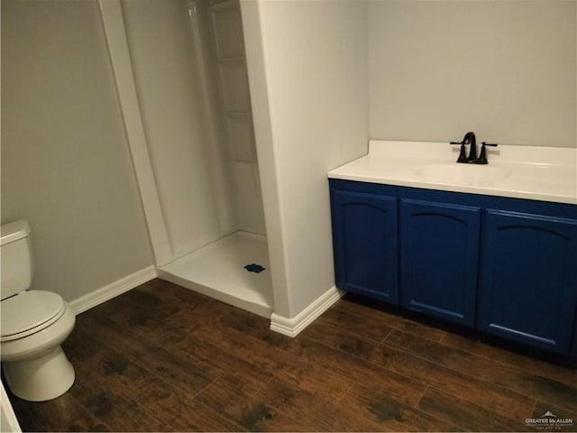 9458 Charles Green Rd, Edcouch, TX 78538 - bathroom featuring wood finished floors, walk in shower, and vanity