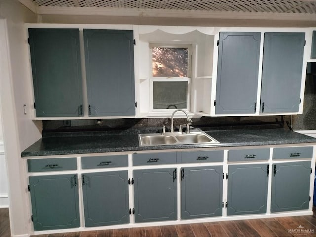 9458 Charles Green Rd, Edcouch, TX 78538 - kitchen with dark countertops and dark wood-style flooring