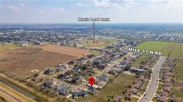 birds eye view of property with a rural view