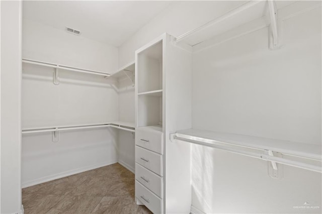 spacious closet with visible vents