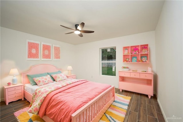 bedroom featuring ceiling fan and dark hardwood / wood-style flooring