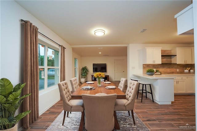 dining space with dark hardwood / wood-style floors