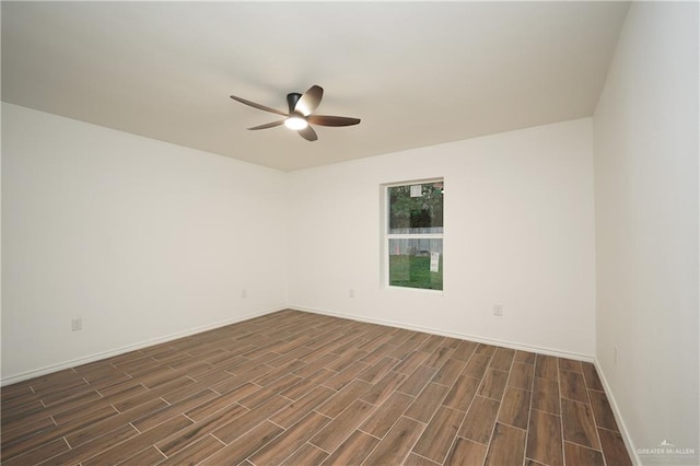 unfurnished room featuring dark hardwood / wood-style floors and ceiling fan