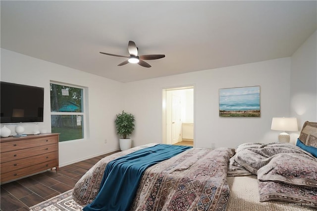 bedroom featuring ceiling fan, dark hardwood / wood-style flooring, and ensuite bath