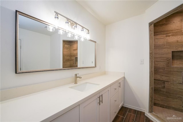 bathroom with vanity and walk in shower