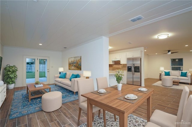 living room featuring ceiling fan and dark wood-type flooring