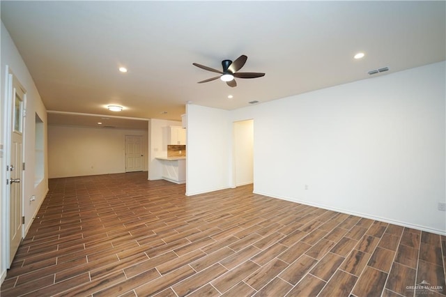 interior space with ceiling fan and wood-type flooring