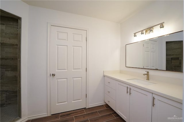 bathroom with hardwood / wood-style floors and vanity