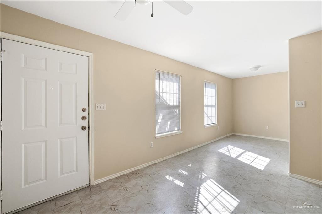 303 Gastel Cir, Edinburg, TX 78539 - foyer with baseboards, marble finish floor, and ceiling fan