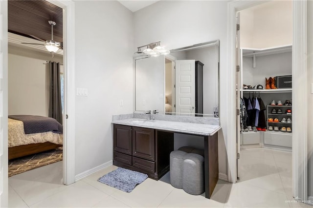 13500 35th St, Edinburg, TX 78541 - ensuite bathroom featuring vanity, a ceiling fan, baseboards, and tile patterned floors