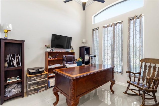 13500 35th St, Edinburg, TX 78541 - home office featuring light tile patterned floors, ceiling fan, and baseboards