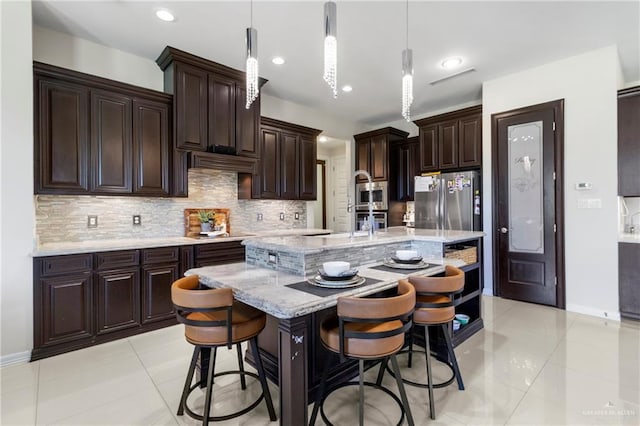 13500 35th St, Edinburg, TX 78541 - kitchen featuring light tile patterned flooring, backsplash, stainless steel appliances, pendant lighting, and recessed lighting