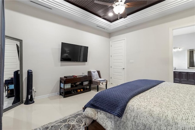 13500 35th St, Edinburg, TX 78541 - tiled bedroom featuring a raised ceiling, baseboards, ceiling fan, and connected bathroom