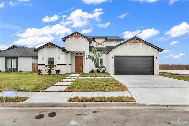 view of front of home with a garage and a front yard