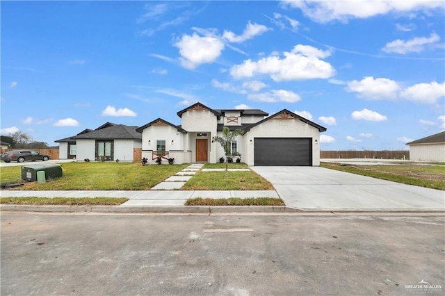 view of front facade featuring a front lawn and a garage