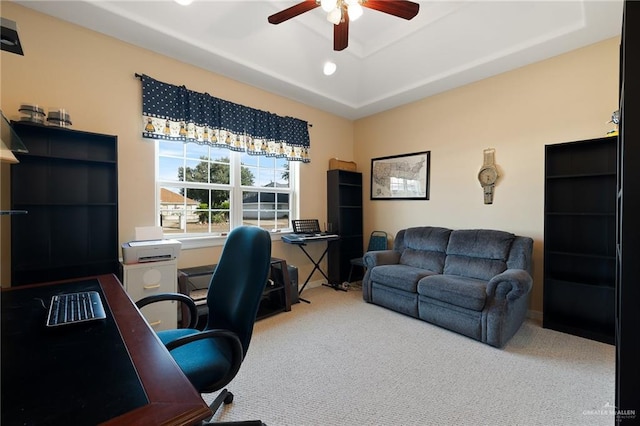 carpeted home office with ceiling fan