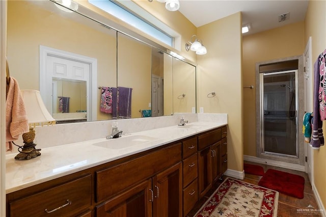 bathroom with tile patterned flooring and vanity