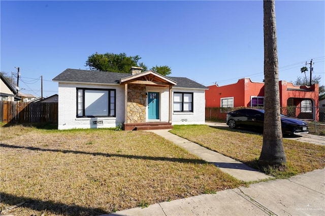 bungalow with a front lawn