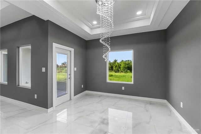 unfurnished room with marble finish floor, baseboards, a tray ceiling, and recessed lighting