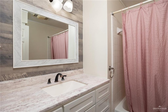 bathroom featuring shower / bath combination with curtain and vanity