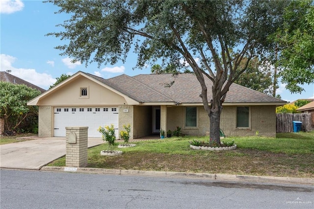 ranch-style home featuring a garage and a front yard