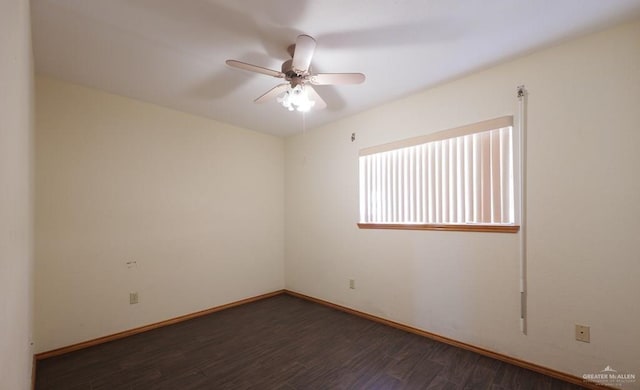 empty room featuring ceiling fan and dark hardwood / wood-style flooring