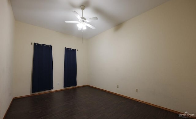 unfurnished room with dark hardwood / wood-style floors and ceiling fan