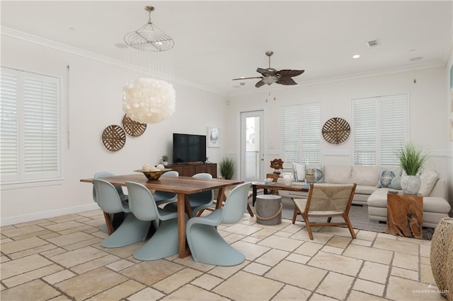 107 E Palm St Unit A, South Padre Island, TX 78597 - dining space with stone tile floors, ceiling fan, recessed lighting, a chandelier, and crown molding
