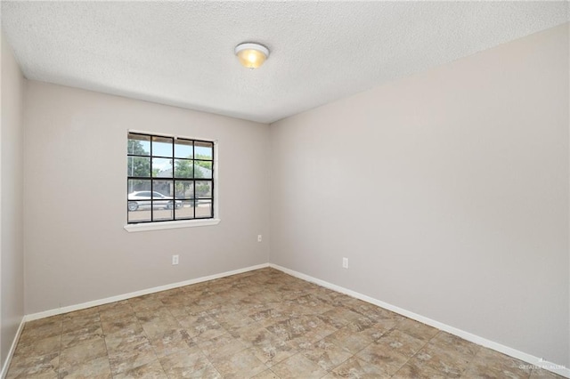 spare room featuring a textured ceiling