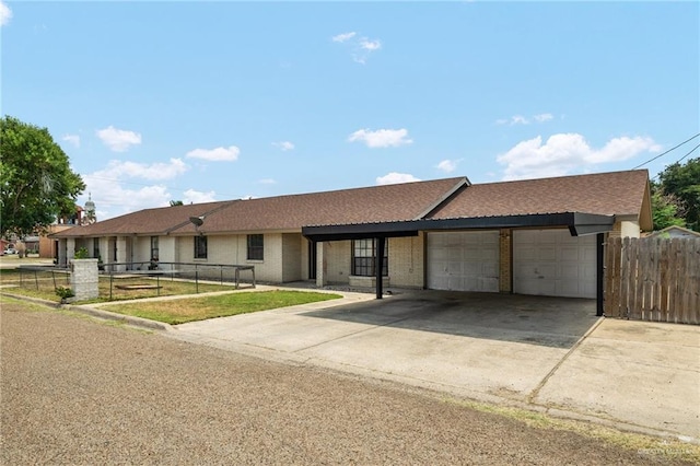 ranch-style home featuring a garage