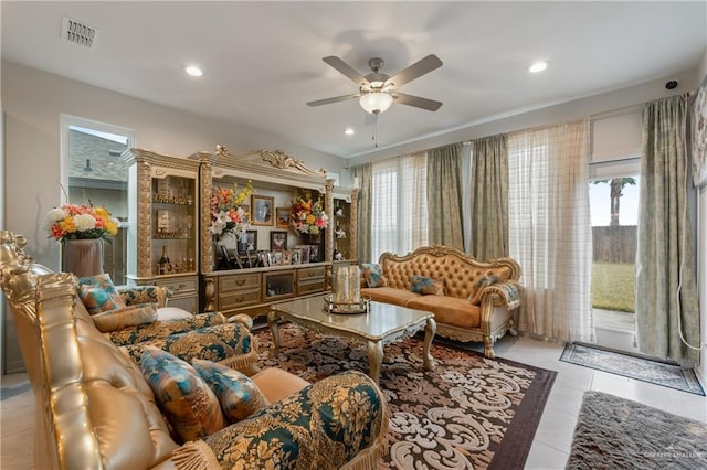 tiled living room featuring ceiling fan